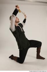 KEETA KNEELING POSE WITH SWORD